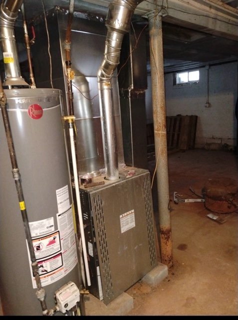 Gas furnace and water heater installed in a basement